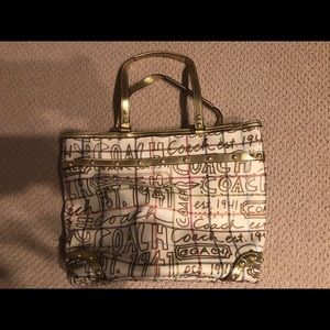 Coach large gold shoulder bag.